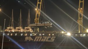 CM46 catamaran Rush being loaded for shipping to the Med