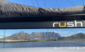 High performance cruising catamaran Rush arriving into Cape Town with Table Mountain backdrop