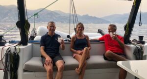 Alexis Roel and Amanda in Rush's cockpit with Amalfi astern