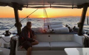 Looking aft from the cockpit of performance catamaran CM46 Rush at sunset