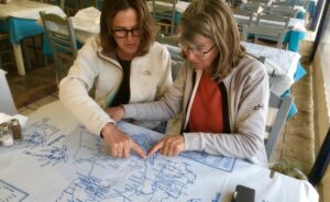 Amanda and Liz route planning at a taverna in Agia Effimia