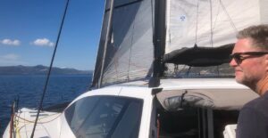 Red sailing performance cruising catamaran Rush