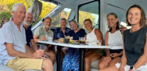 A group of friends aboard CM46 Rush in Kastos, Greece