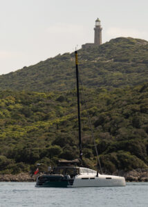 CM46 performance catamaran Rush anchored off Sapienza island