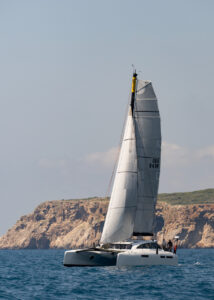 High performance cruising catamaran Rush sailing out of Navarino Bay